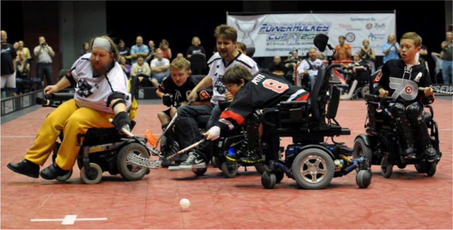 Philadelphia Powerplay forwards Liam Miller, Alex Pitts, and Jake Saxton fight for the ball against the Minnesota Saints in the Powerhockey championship game. The Powerplay went on to lose the game 5-4.

