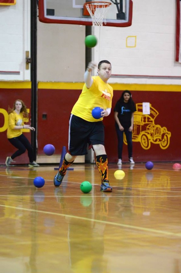 Business teacher, Mike Perez, shows off his fire socks during a game in the tournament. 