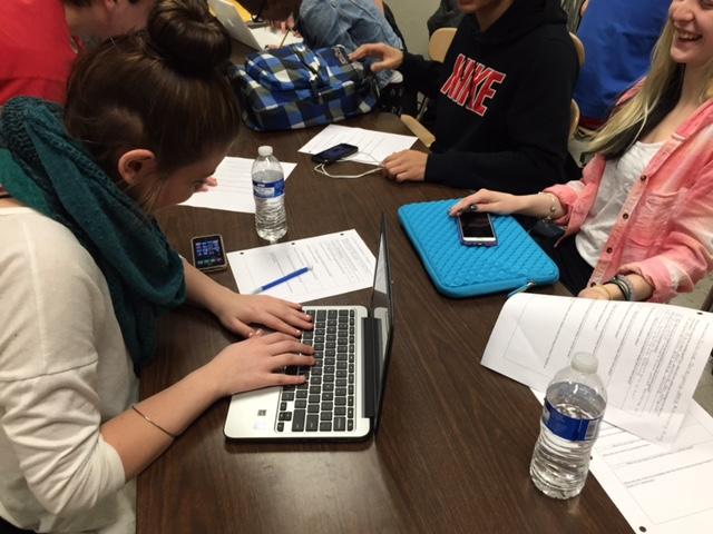 Students Elaine Gregory and Amanda Dougherty use their new Chromebooks to complete work in Media Studies class. 