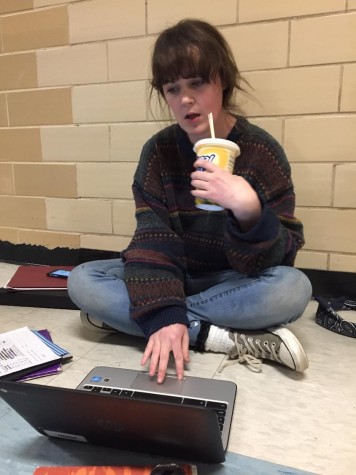 Junior Bridget Murray sips on a WaWa "F'real" milkshake while doing some calculus homework during her break. 