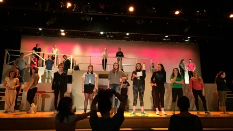 Assistant Director Ms. Montgomery (left), student leader Haley Amdur (center), and Director Heidi Uribe (right) lead the cast during rehearsal. 