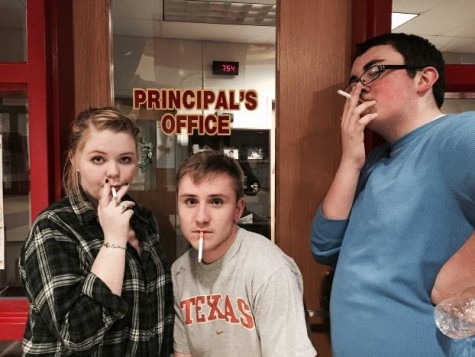 While on their way back to rehearsal, the same trio stopped to get into character by fake smoking outside of Dr. Nesbitt's office. These three have gone into method acting, really trying to become the bad characters they play in the show. 