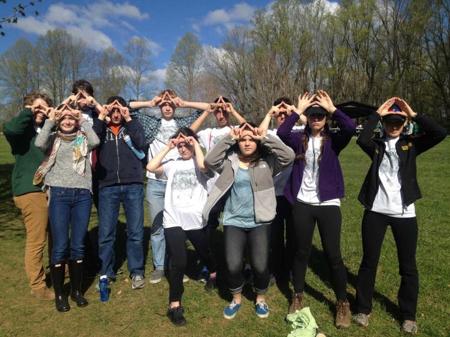 Members of the AWARE club at the Envirothon in Ridley Creek State Park holding the letter A above their heads in solidarity for the club. the A shape oddly resembles a triangle, and thus, the Illuminati but thats a different story.