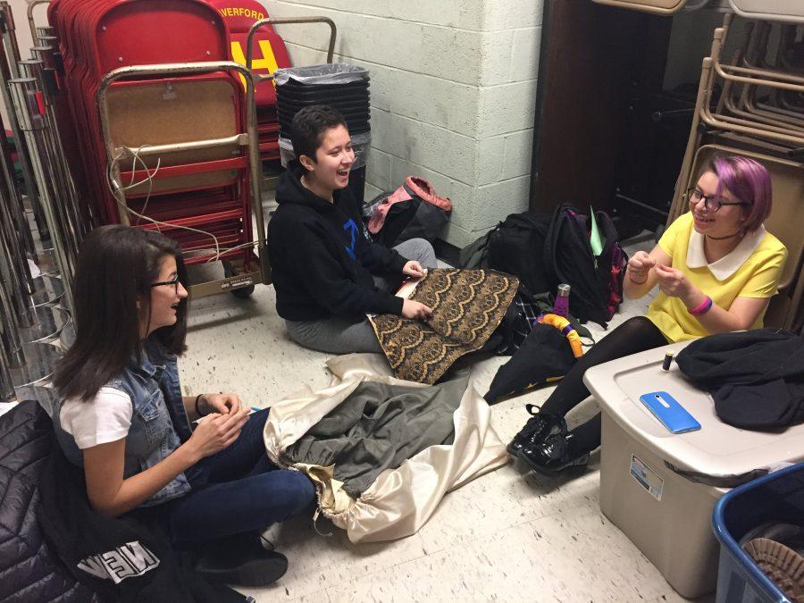 (left to right) junior Nikki Moscony, sophmore Maya Mendoza, and junior Jessica Dillon enjoy their new work space and each others company as they create costumes for the upcoming musical 