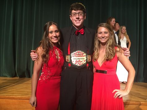 Senior escorts, Gabrielle Gentile and Amira Gallagher, flank Mr. Haverford 2017, Tyler Kimble, in the conclusion of the event. 