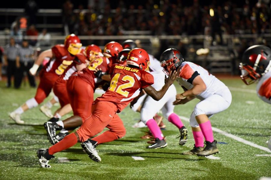 Senior defensive end CJ Weh rushes off the edge to pressure the Penncrest quarterback.