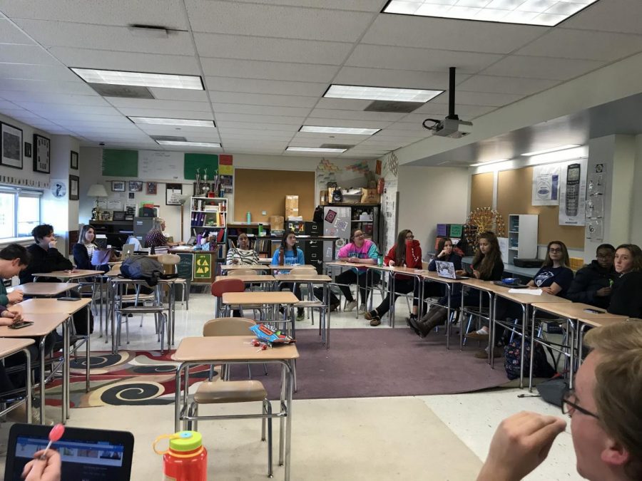 Members of Girl Up sit in a circle to discuss the topic of Sexy Halloween Costumes.  