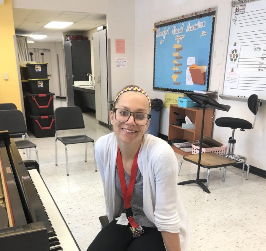 New chorus teacher Kelsey Hendler prepares for rehearsal with students.  