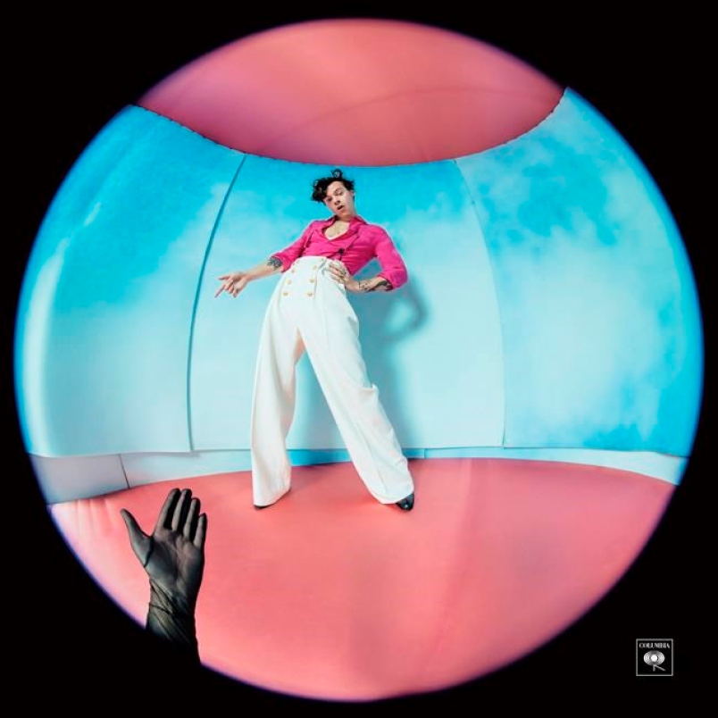 The album cover of Harry Styles Fine Line features the singer through a fisheye lens. 