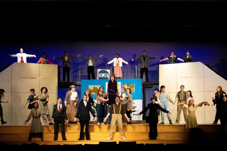 The full ensemble of Urinetown gathers for the finale.