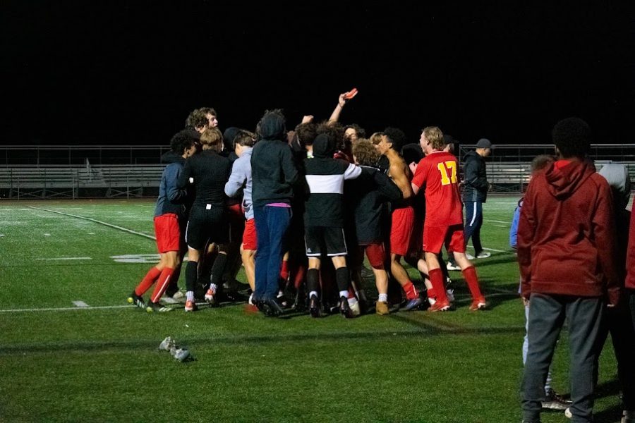 The boys team celebrate after a 4-0 victory.