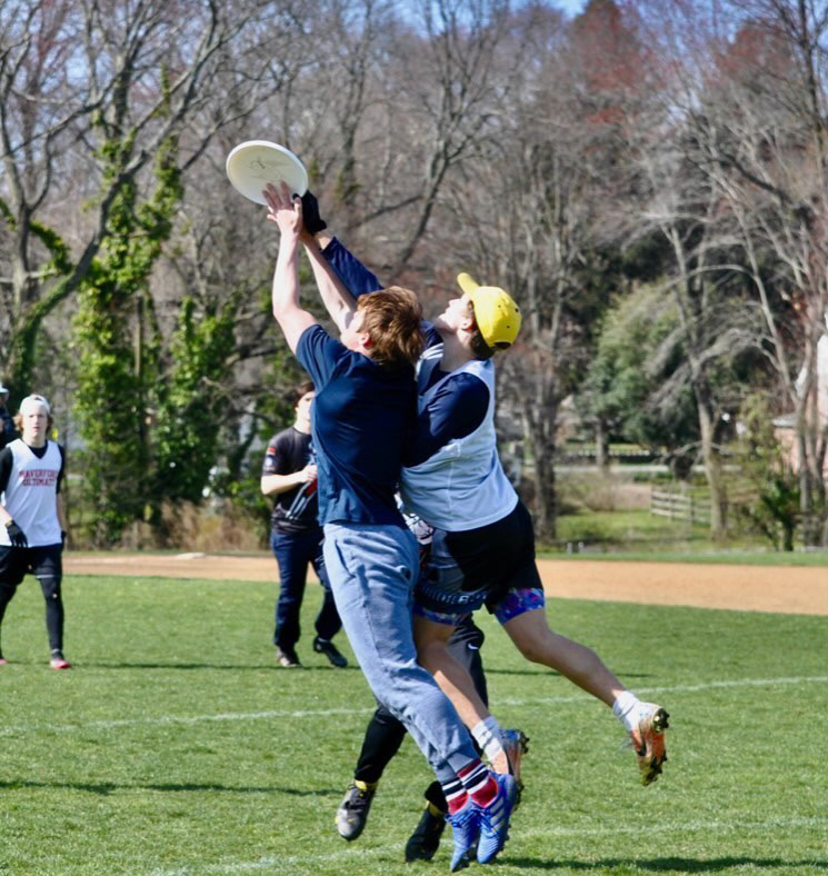 Junior Captain Ethan Sarles leaps for the disc in an attempt to score for the Fords.