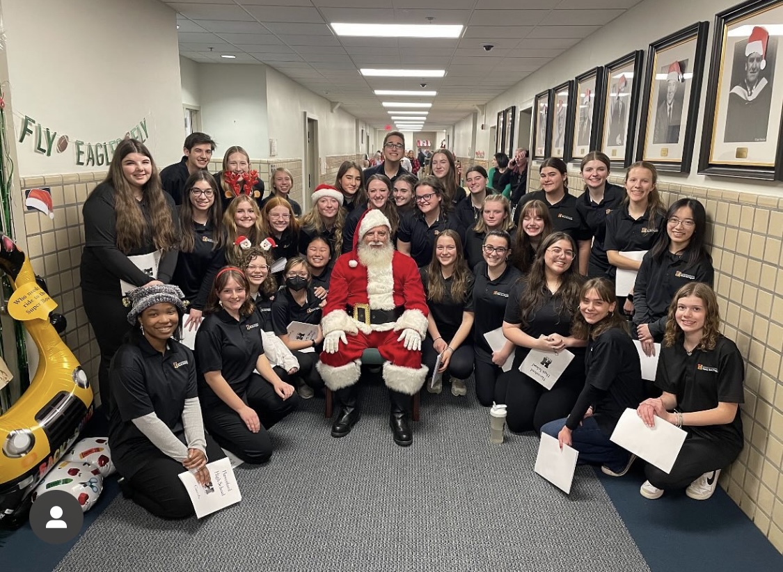 Haverfords Chamber Singers spread holiday cheer by caroling at the Oakmont building.