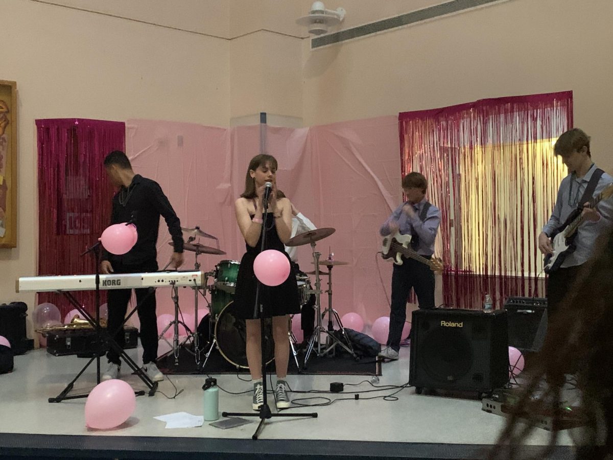 Student band Damsel in Distress rocks out during FROSH.