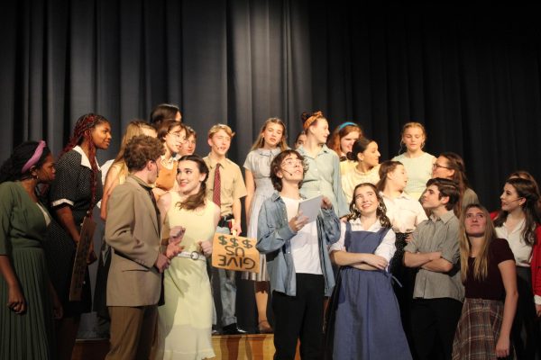 Cast of The Pajama Game in "7 1/2 Cents," featuring Babe Williams (Ella Armandi), Prez (Leo Sacks), and Mae (Amalyah Callahan). 
Photo taken during The Pajama Game dress rehearsal by Mia Dolan. 