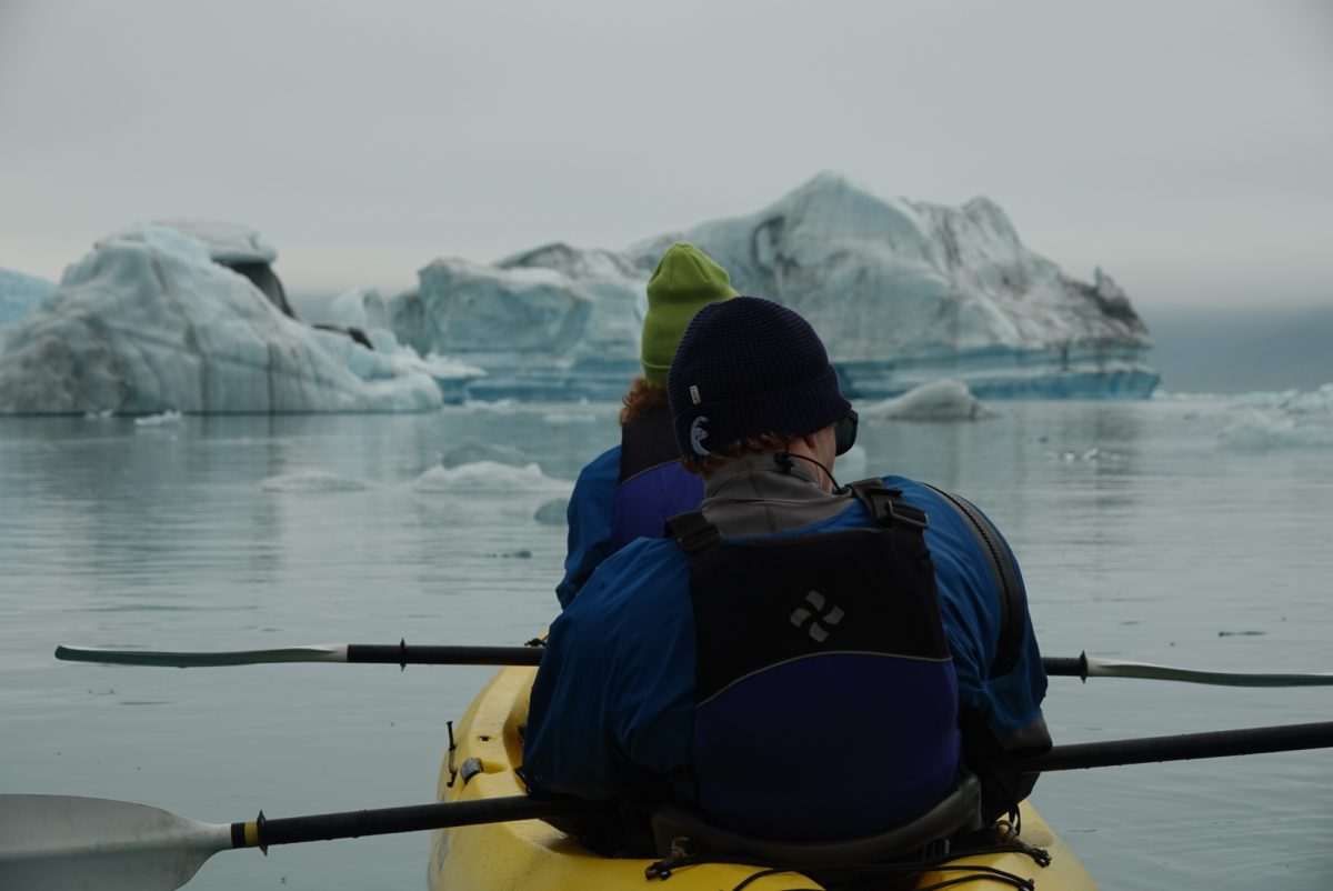 The Graaf family kayaks in Bear Glacier Lagoon, Kenai Fjords National Park, Alaska.