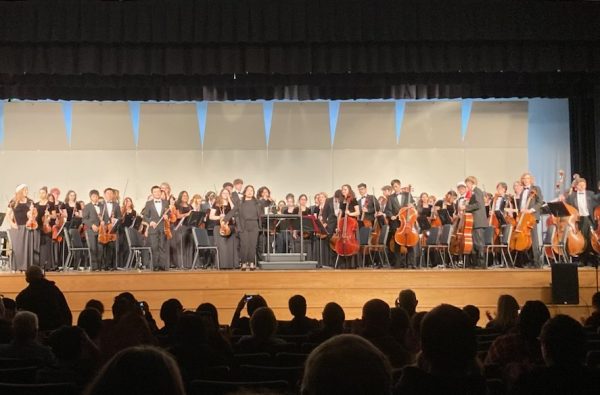 String Orchestra, led by Ms. Kang, takes a bow after their performance.