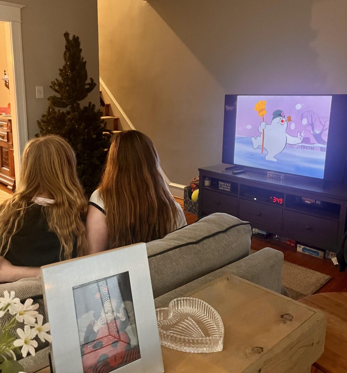 Lexi Crowder and Ali Henninger enjoy classic Christmas film "Frosty the Snowman." 