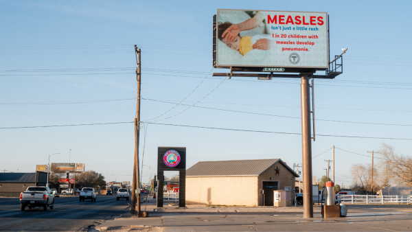 A billboard displays the risks of measles-caused health complications in Seminole, Texas.