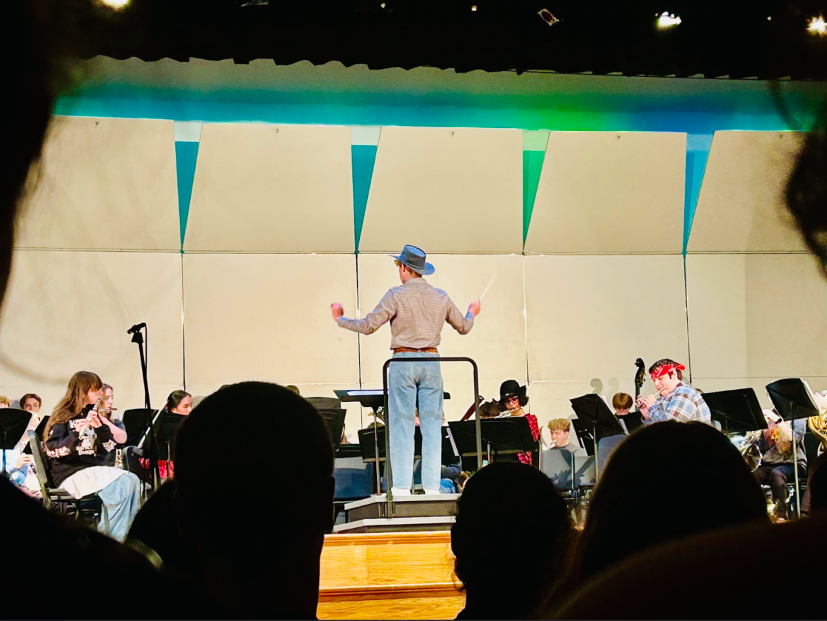 Samuel Graaf conducts the Wind Ensemble as they play his piece, The Death of an American Cowboy, at the inaugural Composers' Concert