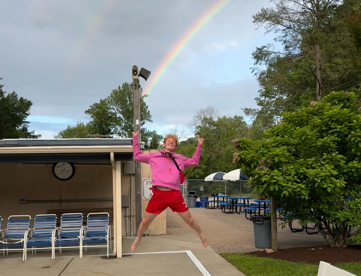 Sam Graaf jumping in front of the rainbow on May 24th, after his shift as a lifeguard. 

