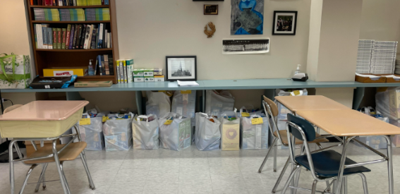 National Honor Society food drive bags are stored in a teacher’s classroom.
